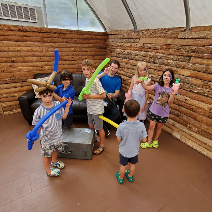 Our balloon twisters are always up for a good sword fight with the kiddos. 