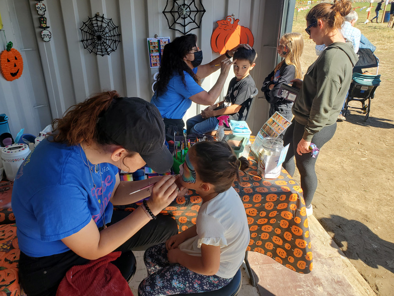 Tow of our talented artists hard at work at the Maize in the City in Thornton, CO. We are there every weekend from the last weekend in September and all through October. 