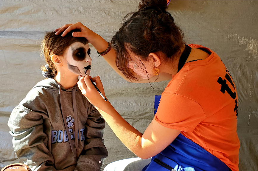 One of our talented, insured facepainters at work during the October busy season. 